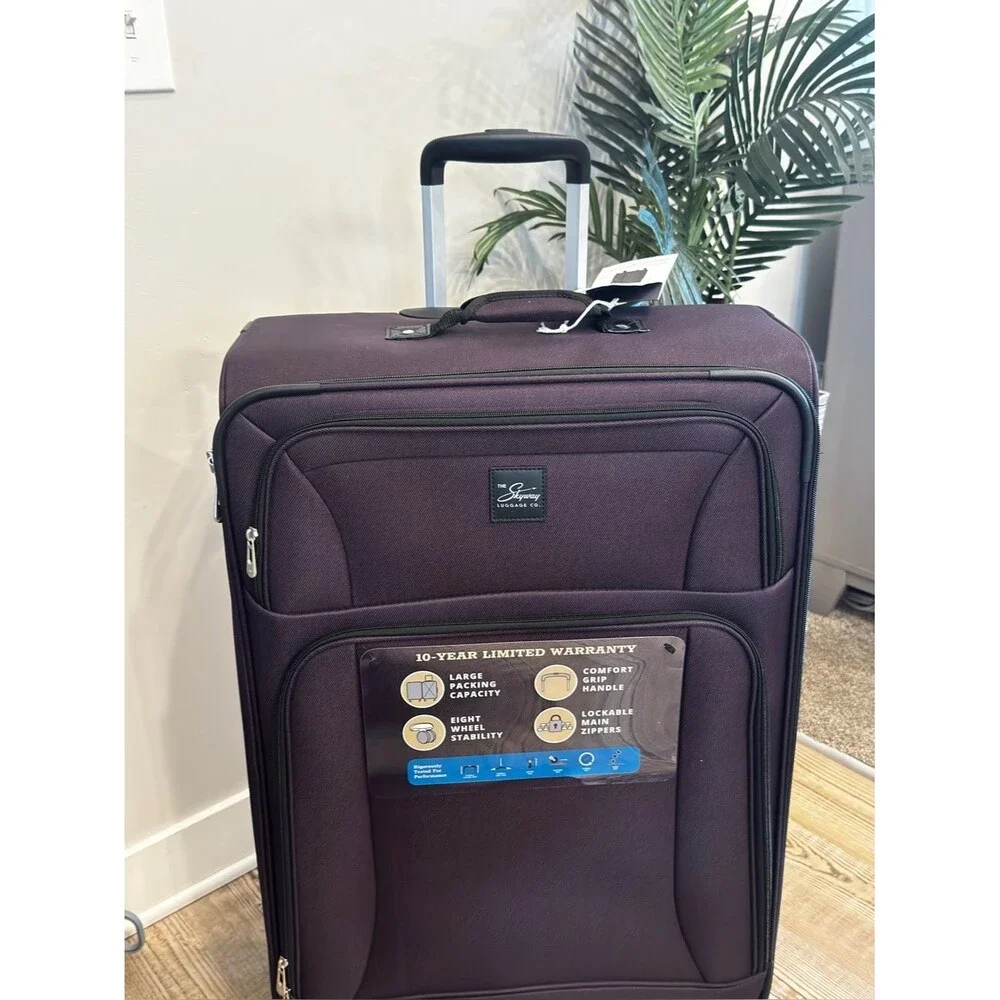 Skyway Epic Large Check-in Spinner Softside purple Suitcase luggage
